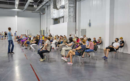 KYIV, UKRAINE - JUNE 17, 2021: People have a rest after vaccination against coronavirus at the COVID -19 mass vaccination center equipped at the International Exhibition Center.のeditorial素材