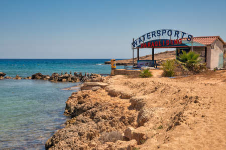 AYIA NAPA, CYPRUS - MAY 23, 2021: Watersports Paragliding station close to Pernera beach. Ayia Napa is a tourist resort at the far eastern end of the southern coast of Cyprus.のeditorial素材