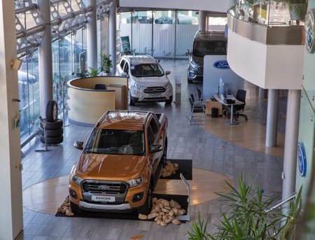 KYIV, UKRAINE - MAY 10, 2021: New Ford cars indoors on display in Winner Automotiv dealership company, view from above.のeditorial素材