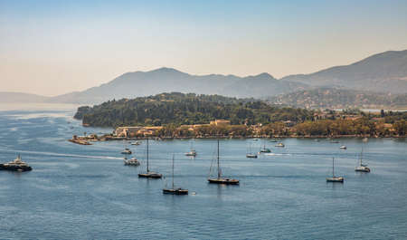 A view of Corfu Town yacht harbour and Anemomilos Windmill, Greece.