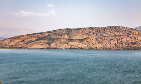 Butrint Lake landscape with mussel farm and mountains in Ksamil, South Albania.の写真素材