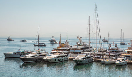 Kerkyra, Corfu, Greece - July 31, 2021: Luxury yachts and ships moored in marina.のeditorial素材