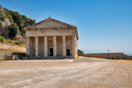 Kerkyra, Corfu, Greece - July 31, 2021: People visit classical greek temple Church of Saint George in famous touristic landmark Old Venetian Fortress.のeditorial素材