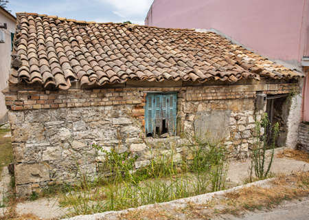 Old abandoned house facade in Lefkimmi, Island of Corfu, Greece.の写真素材