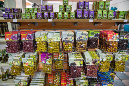 Vraganiotika, Corfu, Greece - August 05, 2021: Mavrodius family factory pressing olive oil shop with wide range of olive products closeup.のeditorial素材
