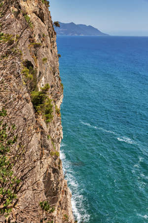 Beautiful scenic sea view with sheer cliff by the sea. Mirtiotissa, Corfu island, Greece.の写真素材