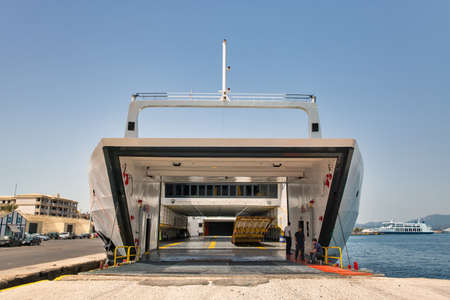 Kerkyra, Corfu, Greece - August 10, 2021: Ano Hora II ferry ship ready for loading with open bow in passenger port of Corfu. The ship was built in 2004.のeditorial素材