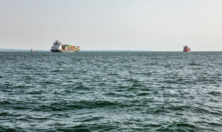 Thessaloniki, Greece - July 27, 2021: Cargo container ship Uni Aspire Evergreen and other in the bay...