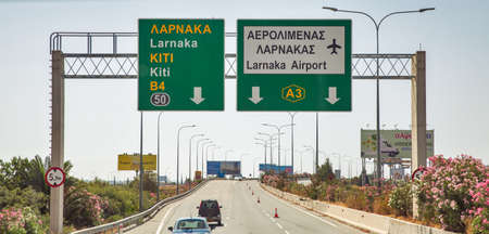 Larnaca, Cyprus - May 31, 2021: Highway road sign for the city and airport and Kiti village. Larnaca...