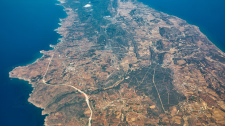 Aerial view over Yeni Erenkoy and Yesilkoy or Agios Andronikos villages on the Karpass Peninsula in Cyprus. It is under the de facto control of Northern Cyprus.の写真素材