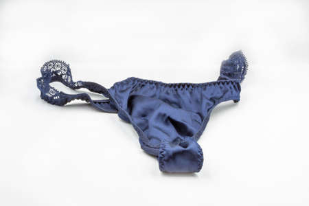 Blue lace panties closeup on white. Lingerie, female lace lingerie, womans erotic panties.