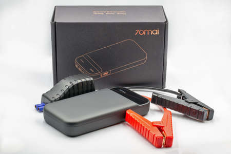 Kyiv, Ukraine - September 09, 2021: Portable Xiaomy 70MAI car jump starter closeup on white....