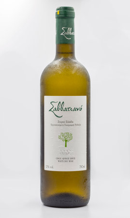 Corfu, Greece - August 05, 2021: Studio shoot of Savatiano Greek white dry wine bottle closeup against white background.のeditorial素材