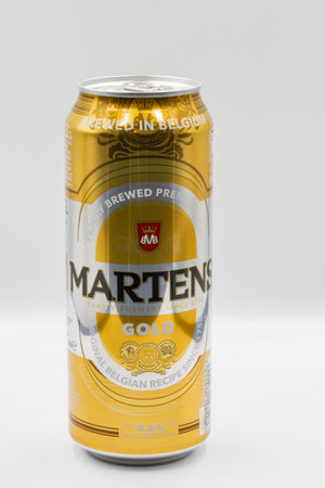 Kyiv, Ukraine - June 18, 2022: Studio shoot of Martens Gold Belgium premium beer can closeup against white. Martens family brewers since 1758.のeditorial素材