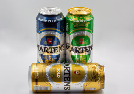 Kyiv, Ukraine - June 18, 2022: Studio shoot of Martens Gold, Extra 7 and Premium 5 Belgian beer cans closeup against white. Martens family brewers since 1758.のeditorial素材