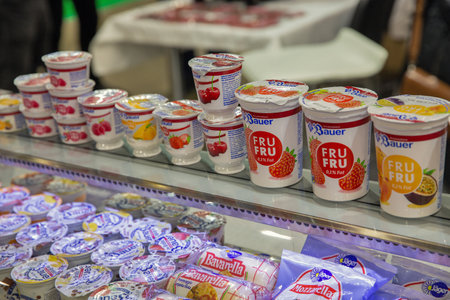 Kyiv, Ukraine - March 29, 2023: Different Bauer yogurts and cheeses in showcase refrigerator during...