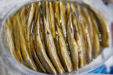 Smoked sprats closeup view from above.の写真素材