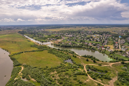 Aerial drone top view over Liukhcha village, Sluch river and lake in Rivne region, Ukraine.の写真素材