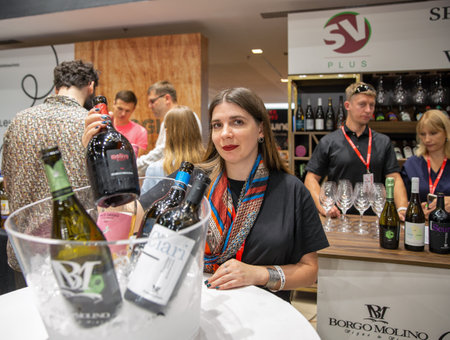 Kyiv, Ukraine - September 30, 2023: Woman presenter works at wine tastings during Be Wine International Wine Show.のeditorial素材