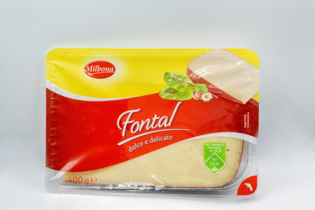 Kyiv, Ukraine - November 06, 2021: Studio shoot of Italian Milbona Fontal cheese package closeup against white background.のeditorial素材