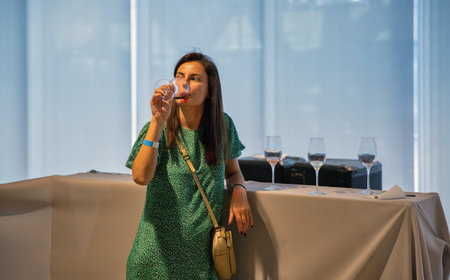 Kyiv, Ukraine - September 30, 2023: People visit winery wine tasting during Be Wine International Wine Show.のeditorial素材