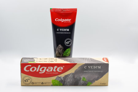 Kyiv, Ukraine - August 05, 2022: Colgate fluoride effective whitening with charcoal toothpaste pack...