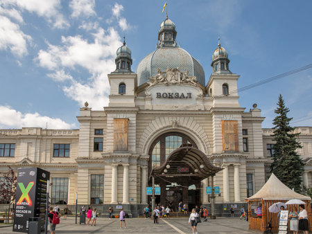 Lviv, Ukraine - September 08, 2023: People visit main railway station building. It is one of the most notable pieces of Art Nouveau architecture in former Galicia, it was opened to the public in 1904.のeditorial素材