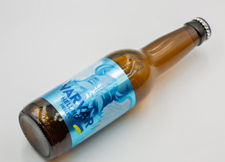 Kyiv, Ukraine - January 08, 2023: Studio shoot of Varvar Hell No India helles Ukrainian craft beer bottle closeup on white.のeditorial素材