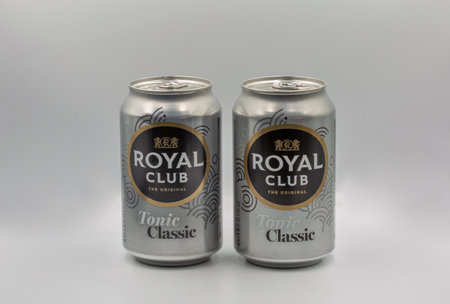 Kyiv, Ukraine - January 08, 2023: Studio shoot of Royal Club tonic classic cans closeup against...