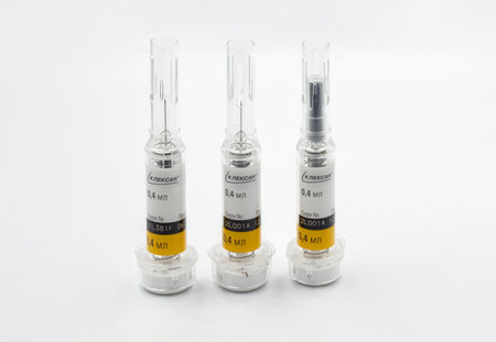 Kyiv, Ukraine - December 18, 2023: Clexane 40 mg Sanofi syringes pre filled solution for injectio and injection needle with automatic safety system closeup on white.のeditorial素材