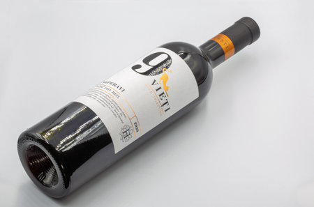 Kyiv, Ukraine - May 11, 2023: Studio shoot of 9 Viety Saperavi Moldavian red dry wine bottle closeup against white background.のeditorial素材