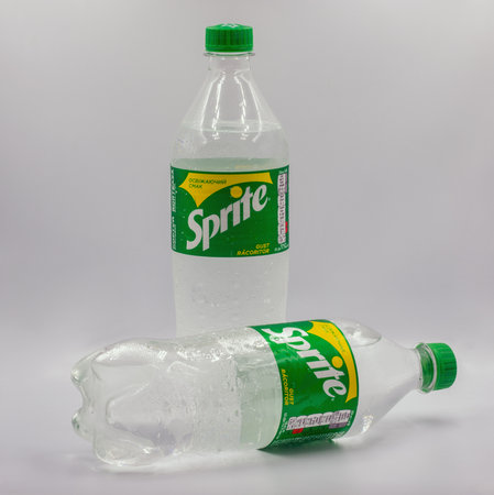 Kyiv, Ukraine - September 16, 2023: Sprite lemon lime sweet soft drink in plastic bottles closeup against white. Sprite is a brand of fruit flavored carbonated soft drinks owned by Coca-Cola.のeditorial素材
