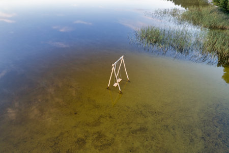 Drone view over White Lake with wooden swing in Rivne region, Ukraine.の写真素材