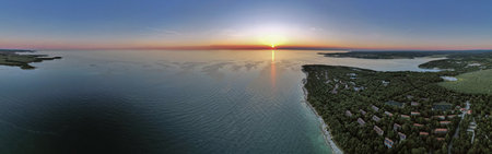 Breathtaking panorama aerial drone view of Lanterna peninsula in Istria, Croatia during golden hour...