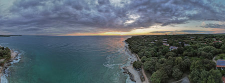 Breathtaking aerial drone panorama view of Lanterna peninsula in Istria, Croatia during golden hour...