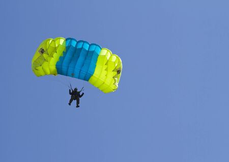 NOVONEZHINO, RUSSIA - MARCH 31, 2012: Airshow devoted to 14 anniversary of the Primorsky Aeroclub, Novonezhino, Russia, march 31, 2012. The program - skydivers jumping.のeditorial素材