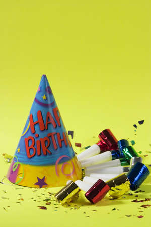 Birthday hat and blowers over green backgroundの写真素材