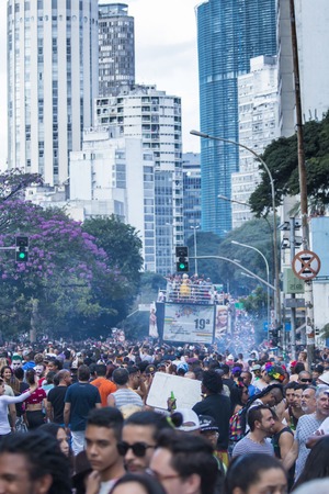 SAO PAULO, BRAZIL - June 7, 2015: crowd at the gay parade, with building the center of the city in the background, in the 19th Gay Pride Parade Sao Pauloのeditorial素材