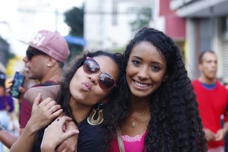 SAO PAULO, BRAZIL - June 7, 2015: An unidentified two girls, celebrating lesbian, gay, bisexual, and transgender culture in the 19th Gay Pride Parade Sao Pauloのeditorial素材