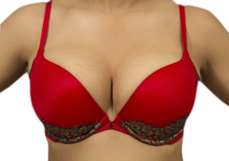 Slender woman wearing a red brassiereの写真素材