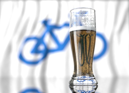 3d realistic illustration of a glass of beer in front of a blurred bicycle flagの写真素材