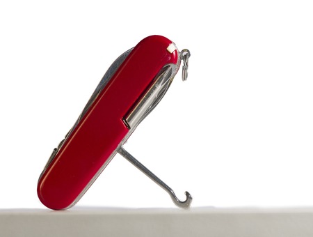 red multi tool knife, with several open toolsの写真素材