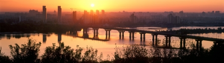 Legendary metal bridge Paton at dawn, amid new quarters, symbolizes the new and the old townの写真素材