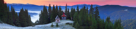 On high alpine pastures of the Carpathians golden autumn arrives with its first snow covering the construction Ukrainian shepherd. This is their church, working in the summer for the Hutsul mountaineersの写真素材