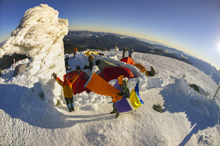 Ukraine, Vorohta- January 1, 2016: Climbers tradition to celebrate the New Year holiday on the highest peak of Ukraine - Goverla, Montenegrin Mountains. Severe frost danger wind. Photos from the droneのeditorial素材