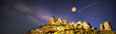 Artistic lighting unreal mountain scenery while rock climbing in the wild mountains provides a unique fantastic effect unearthly planets with fabulous landscapes of Mars. Shooting stars.の写真素材