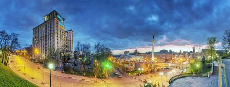 Kiev, Ukraine, April 20, 2015: Evening view of the Independence Square background with monuments, Stella, Institutskaya Street, Performing Arts, Stalin and modern architecture and picturesque clouds in the skyのeditorial素材