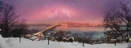 Kiev, Ukraine-January 20, 2015: View a night of the Botanical Garden of the bridge Paton and promenade, by which citizens are ferried in a residential area on the left bank of the center of the capital of Ukraine. The view from the highest mountainのeditorial素材