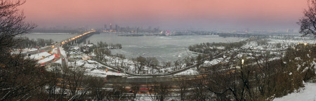 Kiev, Ukraine-January 20, 2015: View a night of the Botanical Garden of the bridge Paton and promenade, by which citizens are ferried in a residential area on the left bank of the center of the capital of Ukraine. The view from the highest mountainのeditorial素材