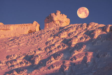 Alpine ridge Montenegro - stands on the slopes of the Ukrainian Carpathians ancient observatory built by the Poles in 1938-39, against a background of deep snow peaks and bitter cold strong wind waiting climber - extremalsのeditorial素材